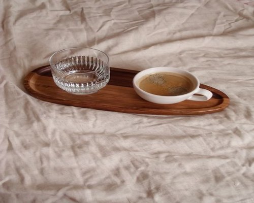 water and a simple breakfast beside coffee