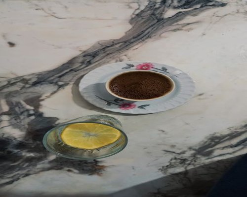 water and a simple breakfast beside coffee